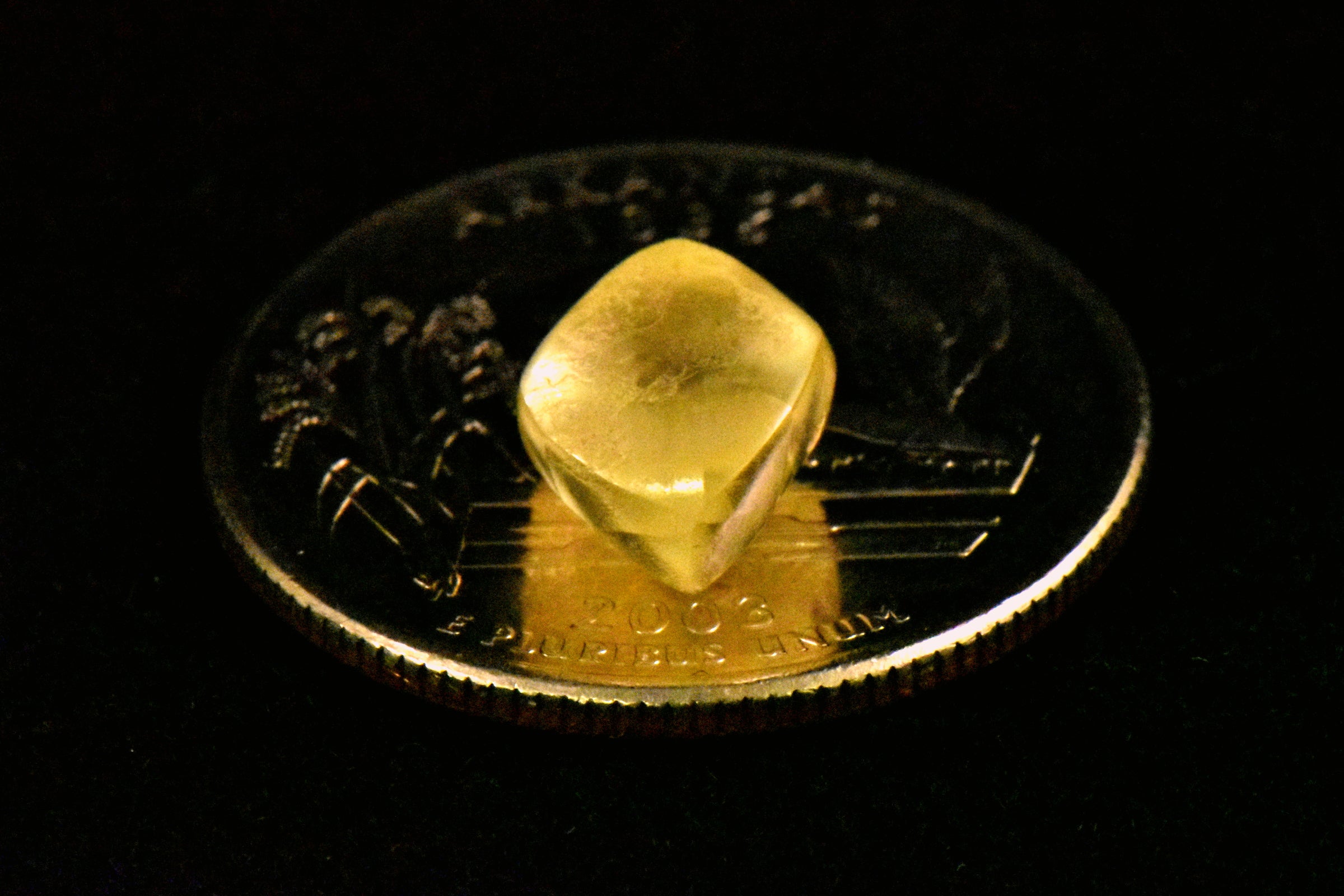 2021 largest diamond found at Crater of Diamonds State Park. It's a 4.38 carat yellow diamond sitting on top of a quarter for scale